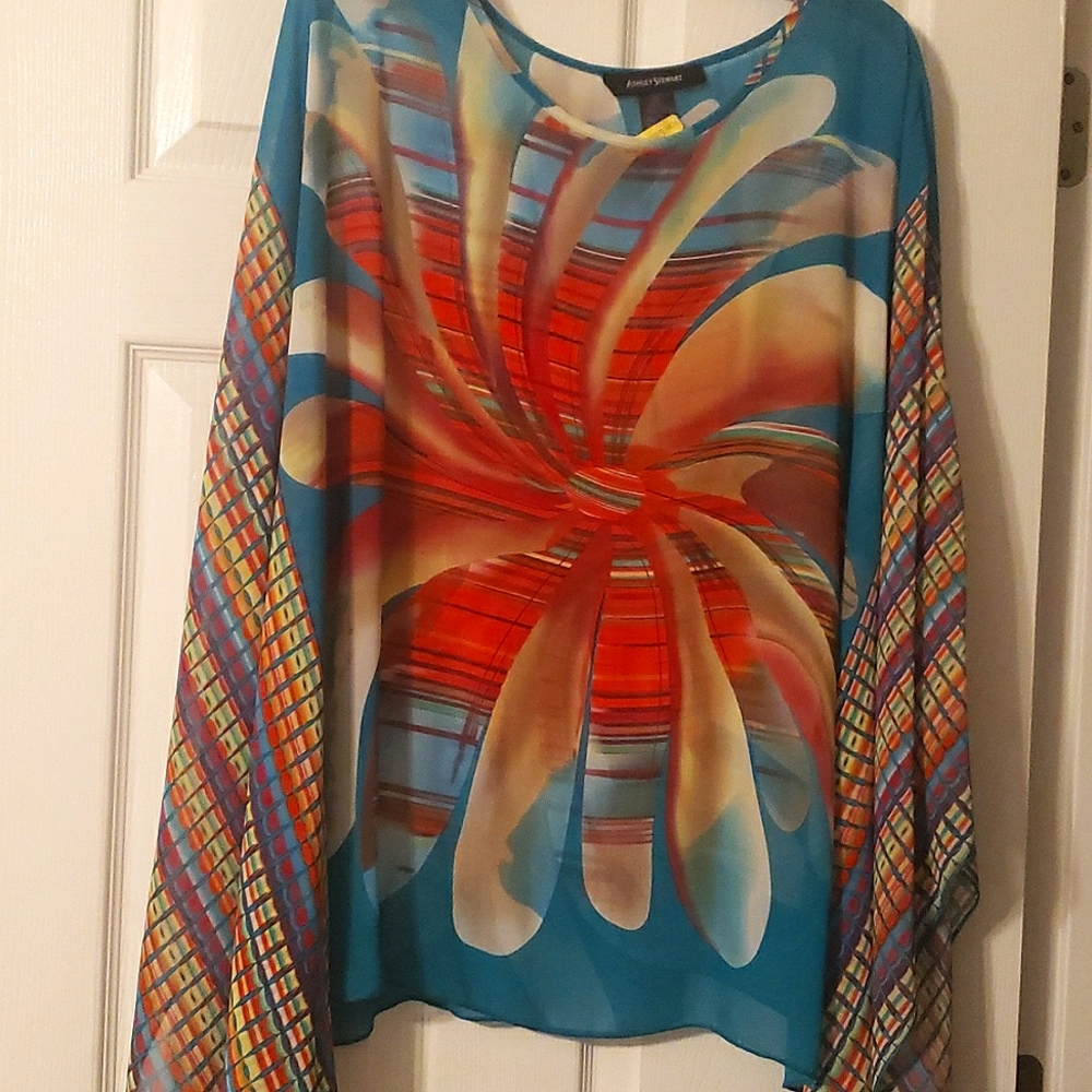 Turquoise flower shirt with vibrant colors.